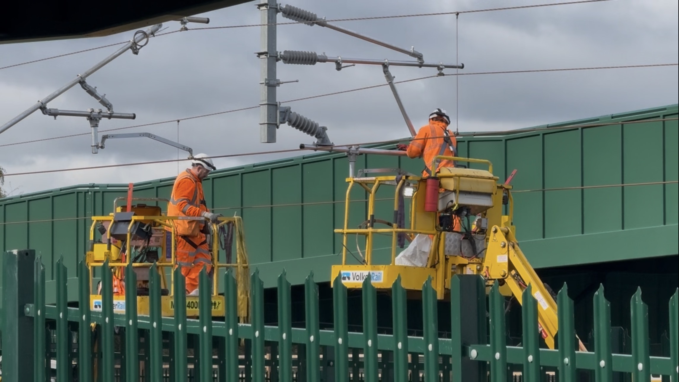 Volker Rail engineers on cherry pickers working on overhead line equipment west of Garforth station, October 2026